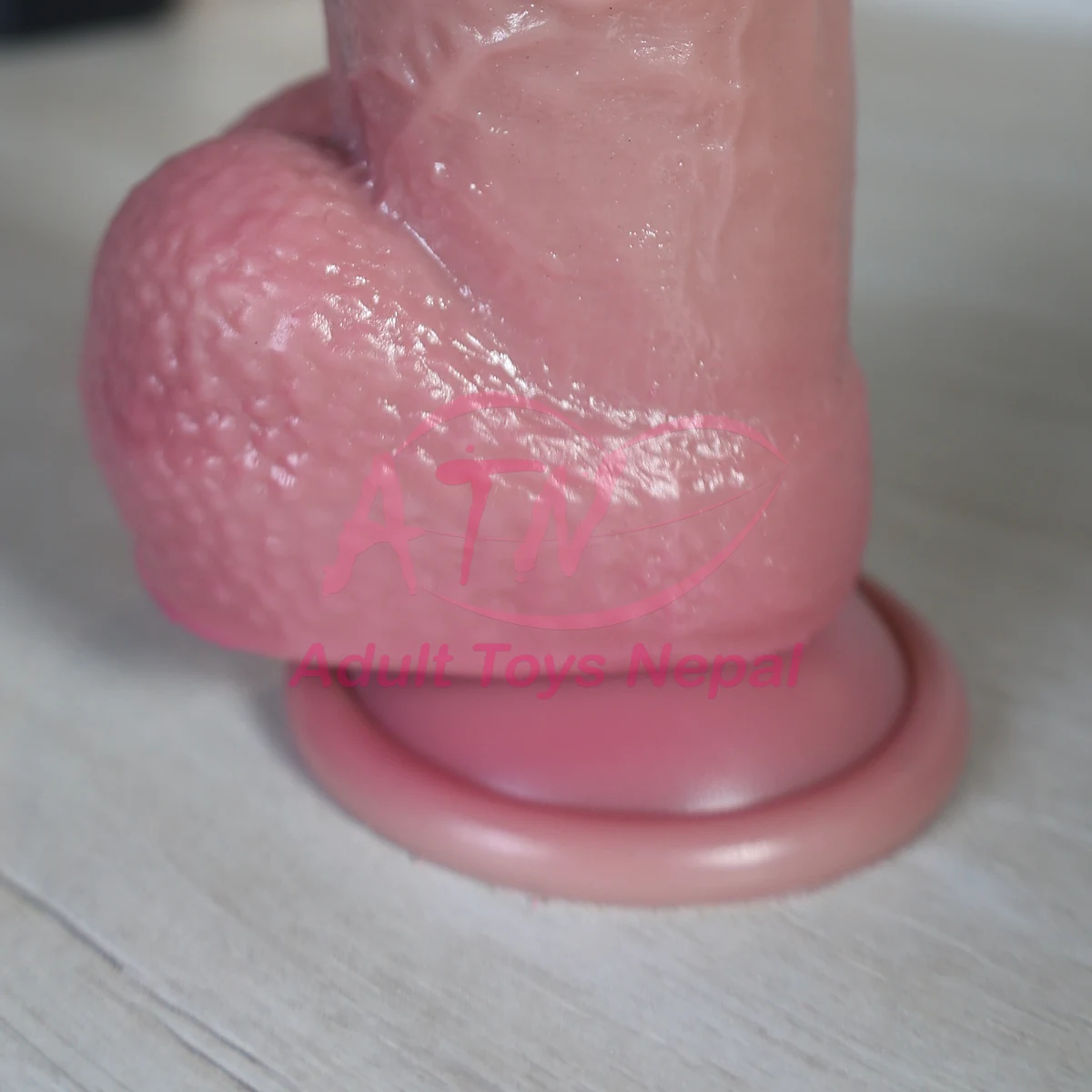 Textured balls and round suction cup base of the 8.5 inch realistic dildo